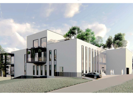 Charred Wooden Shingles and Green Roofs Redefining Communal Living Spaces