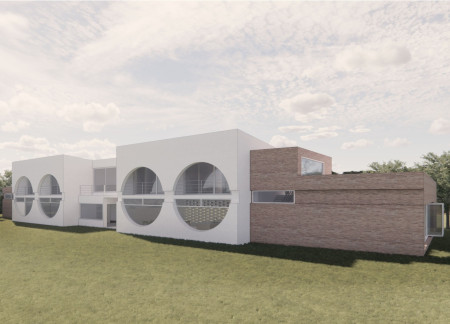 Circular Windows and Red Brick Create a Harmonious Retreat Rooted in Nature