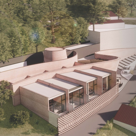 Terracotta Walls and Curvilinear Shapes in a Versatile Guest House Design