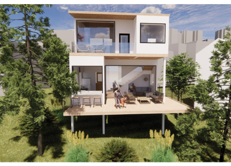 Cantilevered Decks Featuring Natural Wood Cladding and Sustainable Landscaping for Private Coastal Living