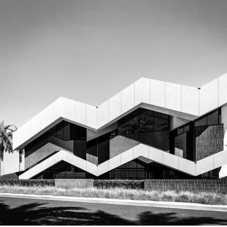 Zigzag Concrete Facade Enhanced by Colorful Ceramic Tiles in Modular Residential Design