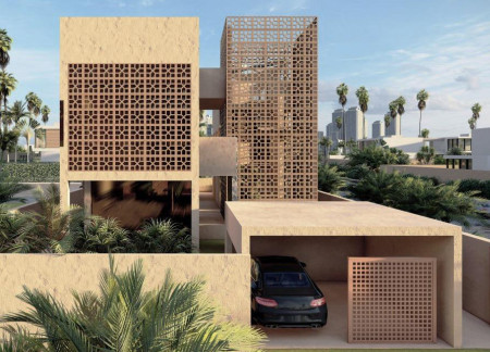 Charred Wood Shingles and Clay Walls Forming a Sustainable Oasis in the Emirates