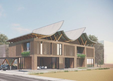 Curvilinear Roofs and Brick Construction Harmonize with Desert Landscape