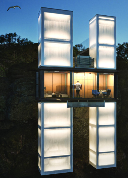 Elevated Microhome Crafted from Polycarbonate and Aluminum Panels on Rugged Cliffside
