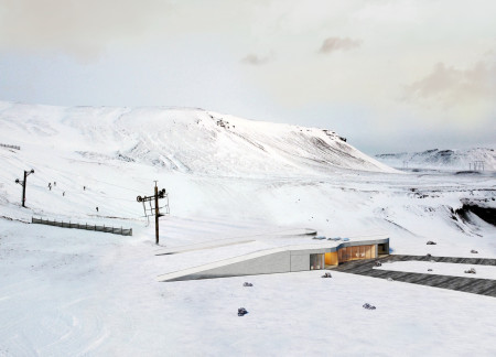 Lava Stone Structure with Undulating Roof Designed for Ski Access