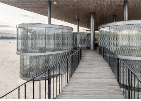 Circular Living Spaces Enhanced by Metal Mesh and Natural Light Integration