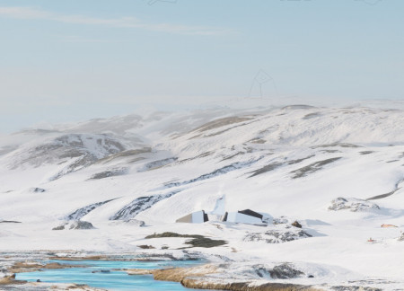 Reflective Glass and Basalt Retreat Designed for Community Engagement