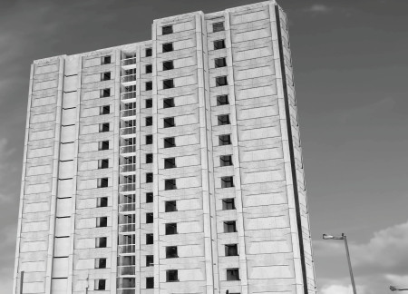 Reclaimed Concrete and Metal Integration for Flexible Urban Housing Solutions