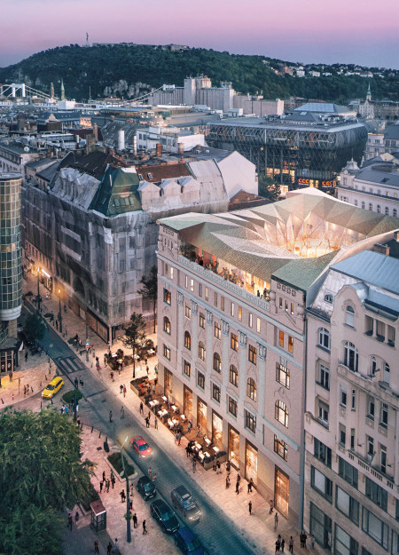 Glass Enclosed Atrium Highlighting Historical Motifs in a Stone Facade