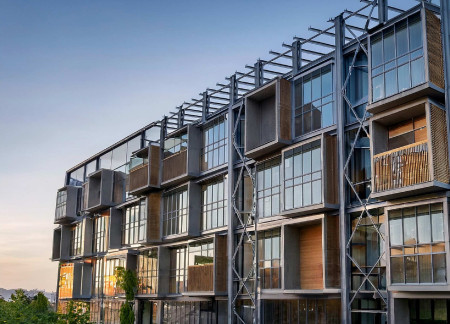 Charred Wooden Shingles and Steel Framework Enhance Modular Community Living