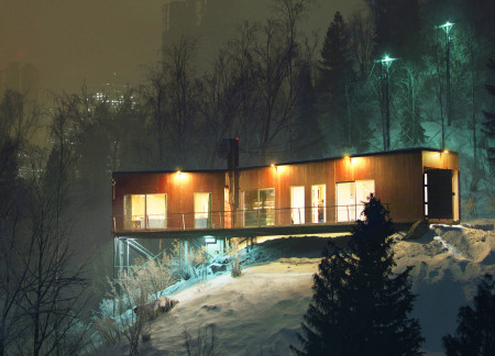 Elevated Shipping Container Structure Blending Steel and Natural Wood in a Cold Climate Environment