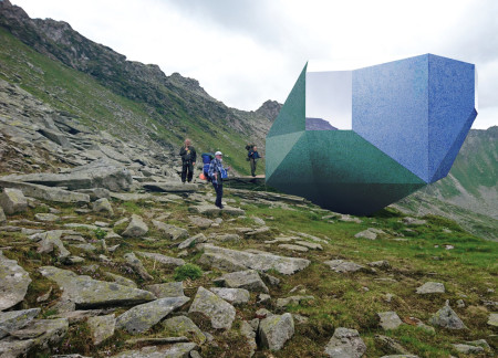 Cubic Shelter Featuring Sheet Metal Camouflage and Plywood Interiors in Mountainous Terrain