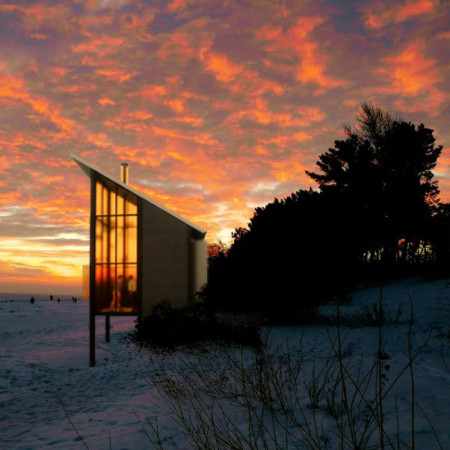 Amber-Hued Shelters Built with Marine Plywood and Straw Insulation for Coastal Retreats