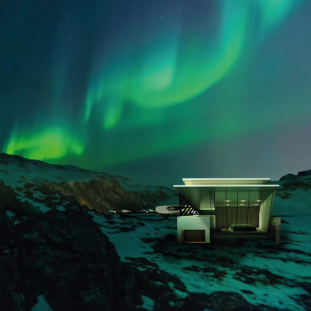 Curved Titanium Cladding and Reclaimed Wood in a Residential Retreat Embracing Auroral Views
