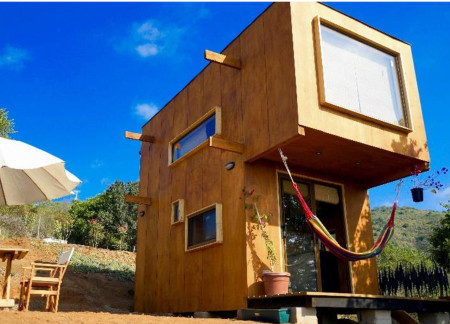 Suspended Living in Marine Plywood with Natural Light Emphasis