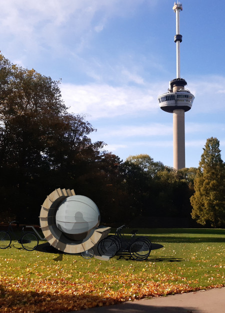 Curved Acrylic Shelter with Plywood Framework for Community Reading