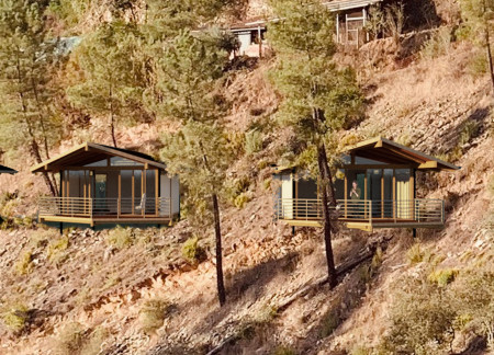 Cobbled Retreat Featuring Natural Wood Cabins for Mindful Reflection