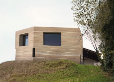 Cavernous Tasting Room Crafted from Rammed Earth with Integrated Seating