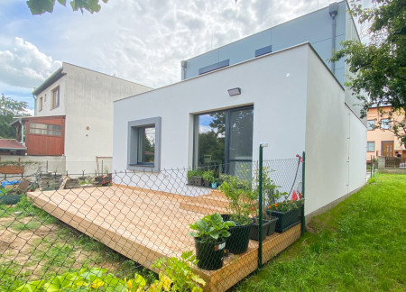 Geometric Precision and Natural Light in Gray Panels and Wooden Accents