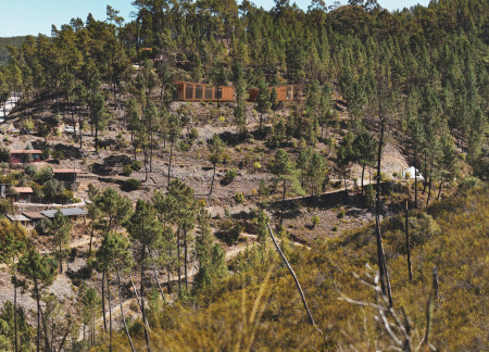 Elevated Timber Retreat with Photovoltaic Sustainability Features