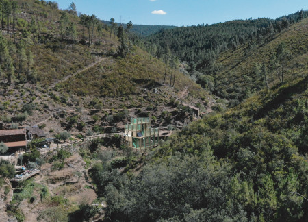 Bay Windows and Terraces Integrate Comfort Within a Wooden Retreat