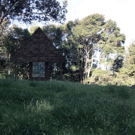 Glass Fireplace and Mobile Altar Within a Wooden Pyramid Retreat