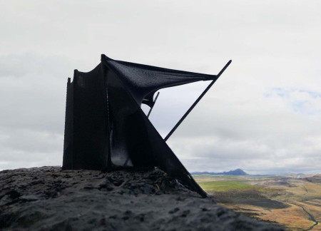 Fluid Steel and Corten Structure Overlooking Volcanic Landscape
