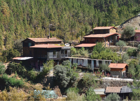 Rammed-Earth Foundations and Timber Framing in a Nature Retreat