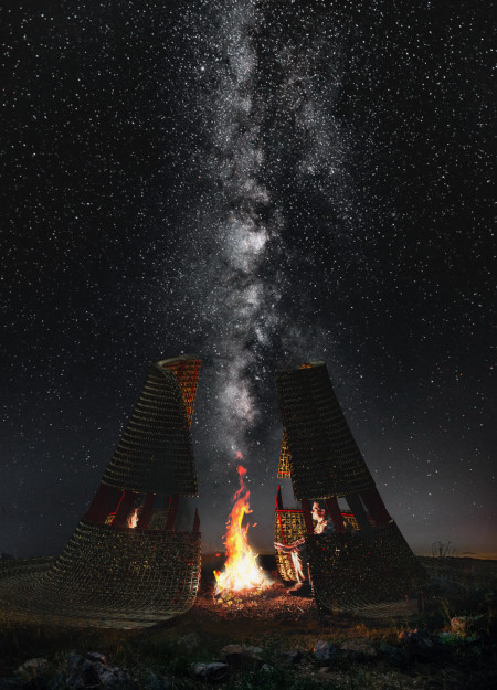 An Observation Platform Framed by a Lava-Inspired Footbridge
