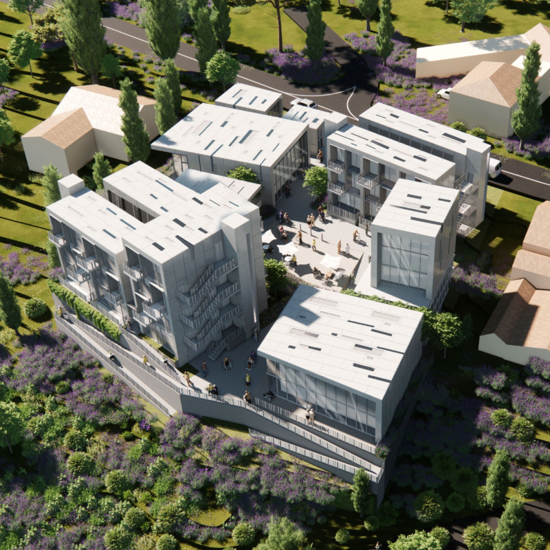 Charred Wood Shingles and Glass Facades Integrate Seamlessly in a Community-Centric Residential Facility