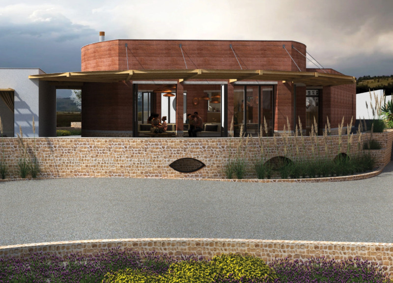 Rammed Earth Walls and Corten Steel Framework Defining a Community Space in Olive Country