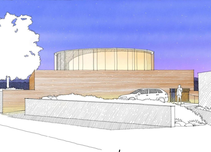 Curved Glass Forms and Brick Textures in a Sustainable Rural Residence