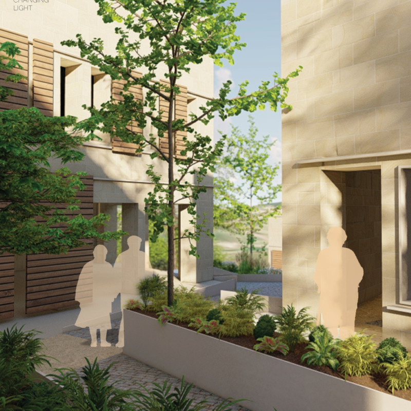 Charred Wood Shingles and Local Stone Enhance Community Living in Natural Harmony