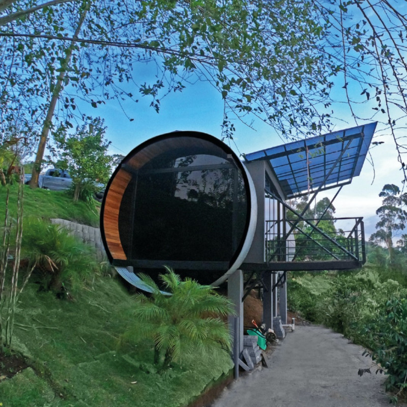 Cylindrical Structure with Local Timber and Solar Integration for Compact Living