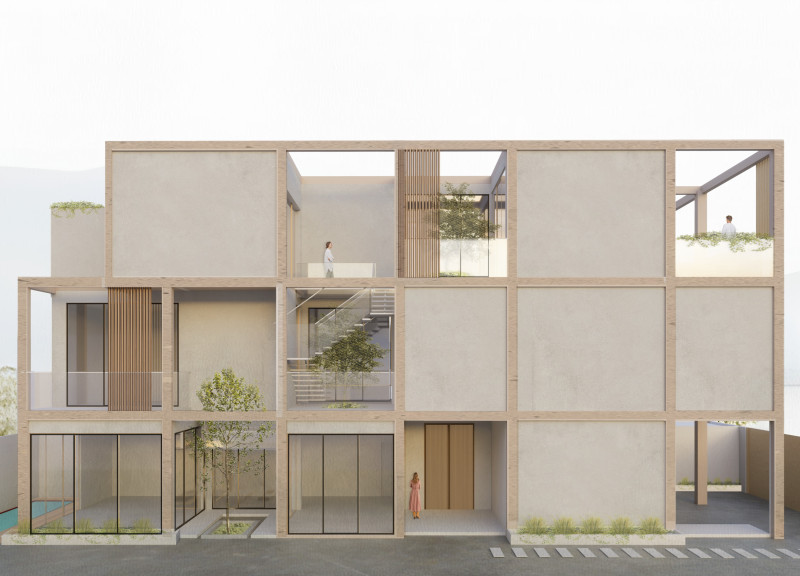 Charred Wooden Shingles and Limestone Create a Sustainable Family Dwelling in a Community Context