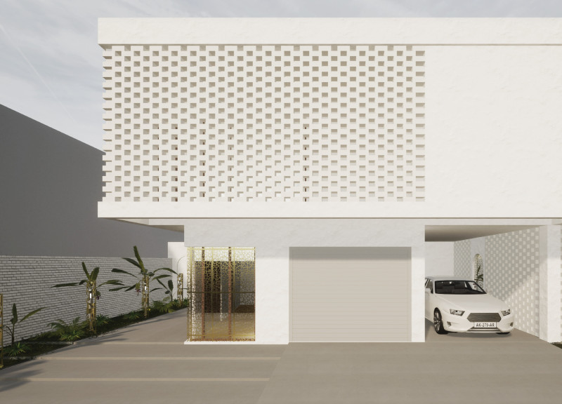 Perforated Brass Facade and Clay Block Design for Sustainable Family Living