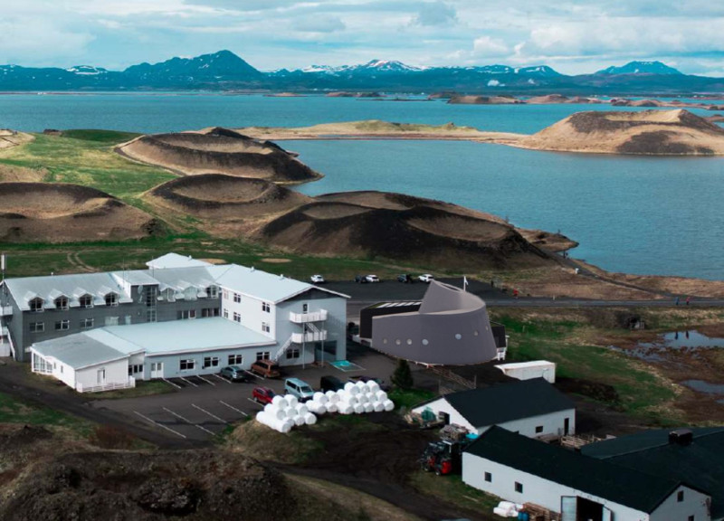 Charred Wooden Shingles and Recycled Concrete in a Thermal Spa Immersed in Volcanic Landscape