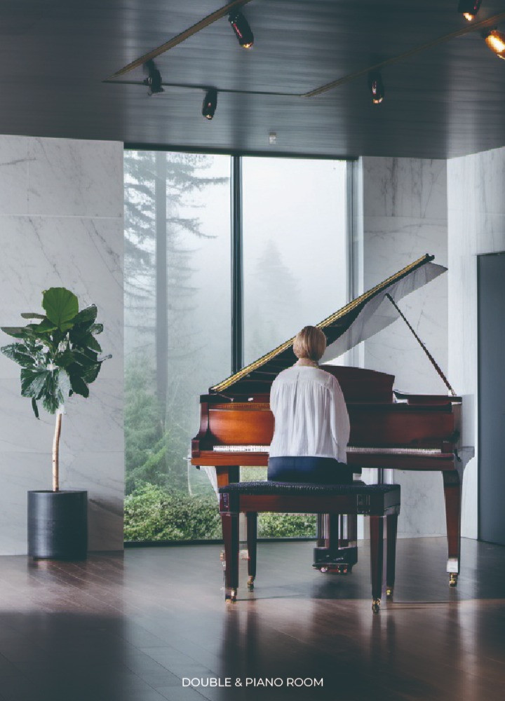 Sustainable Living Spaces with Green Roofs and Piano Rooms Crafted from Concrete and Wood