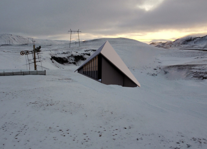 Charred Wooden Shingles and Glass Facades in a Multifunctional Civic Center