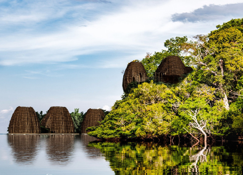 Curved Structures Crafted from Glued Laminated Timber Integrating Natural Fabrics in a Sustainable Community Setting