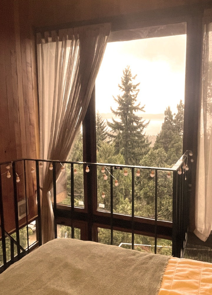 Corten Steel Cladding Elevates Compact Micro-Home on Steep Slope