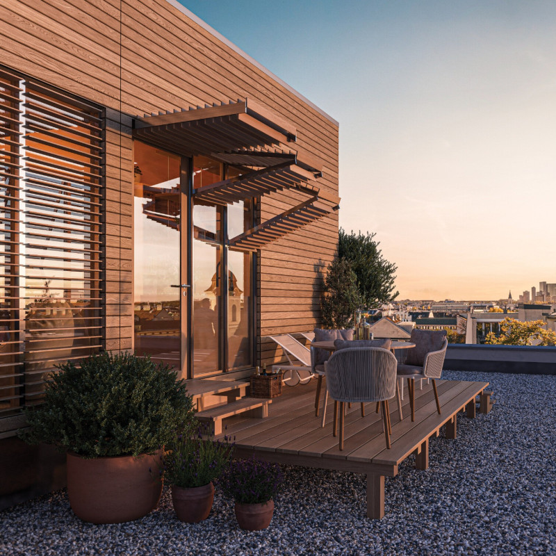 Charred Wood Facade and Modular Design Transforming Urban Rooftops into Functional Living Spaces