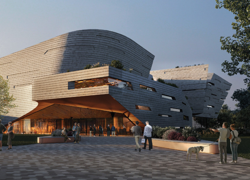Central Atrium Emphasizing Natural Light Within a Charred Wooden Shingle Exterior
