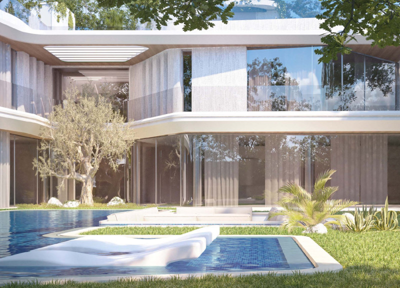 Fluid Curvilinear Forms with Glass and Reinforced Concrete in a Luxurious Coastal Residence