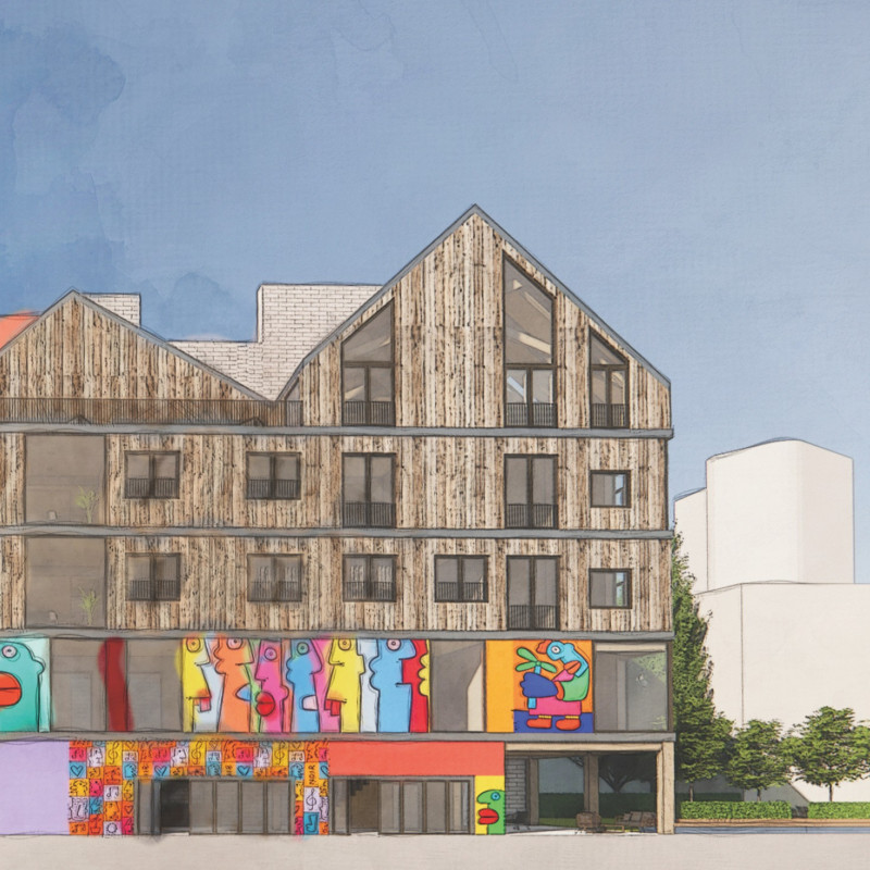 Charred Wooden Shingles and Reclaimed Steel Define a Multifunctional Community Hub