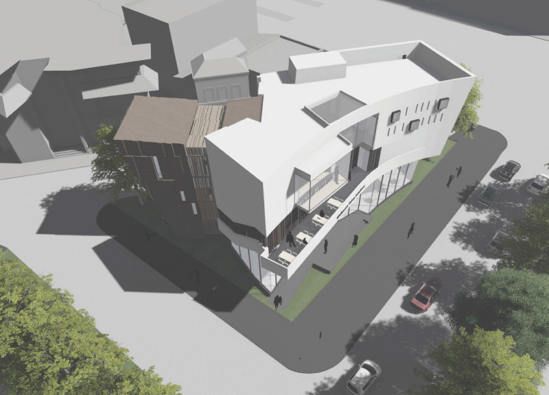 Charred Wooden Shingles and Glass Façade Create a Dynamic Learning Environment for Tattoo Artistry