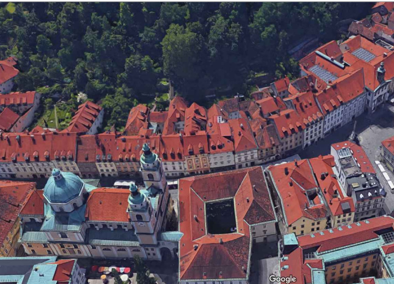 Charred Wooden Shingles and Green Roofs Define a Multifunctional Living and Work Space