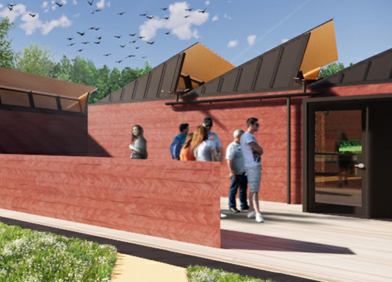 Charred Wood Accents and Hewn Logs Create a Visitor Center Embracing Nature