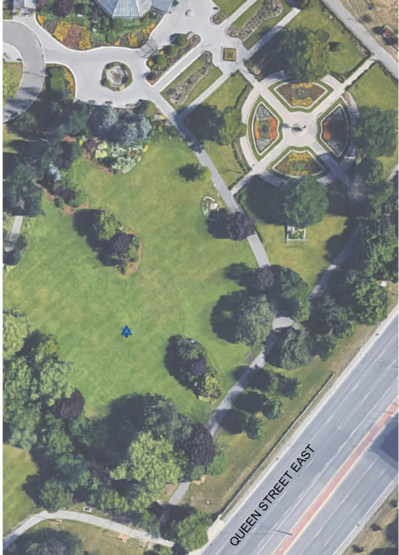 Reflective Stainless Steel and Weathered Steel Surrounding a Circular Space for Remembrance