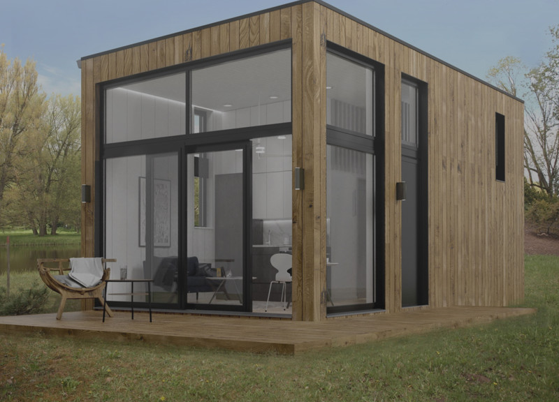 Maximizing Natural Light with Eco Cladding and Glass Elements in a Small Retreat